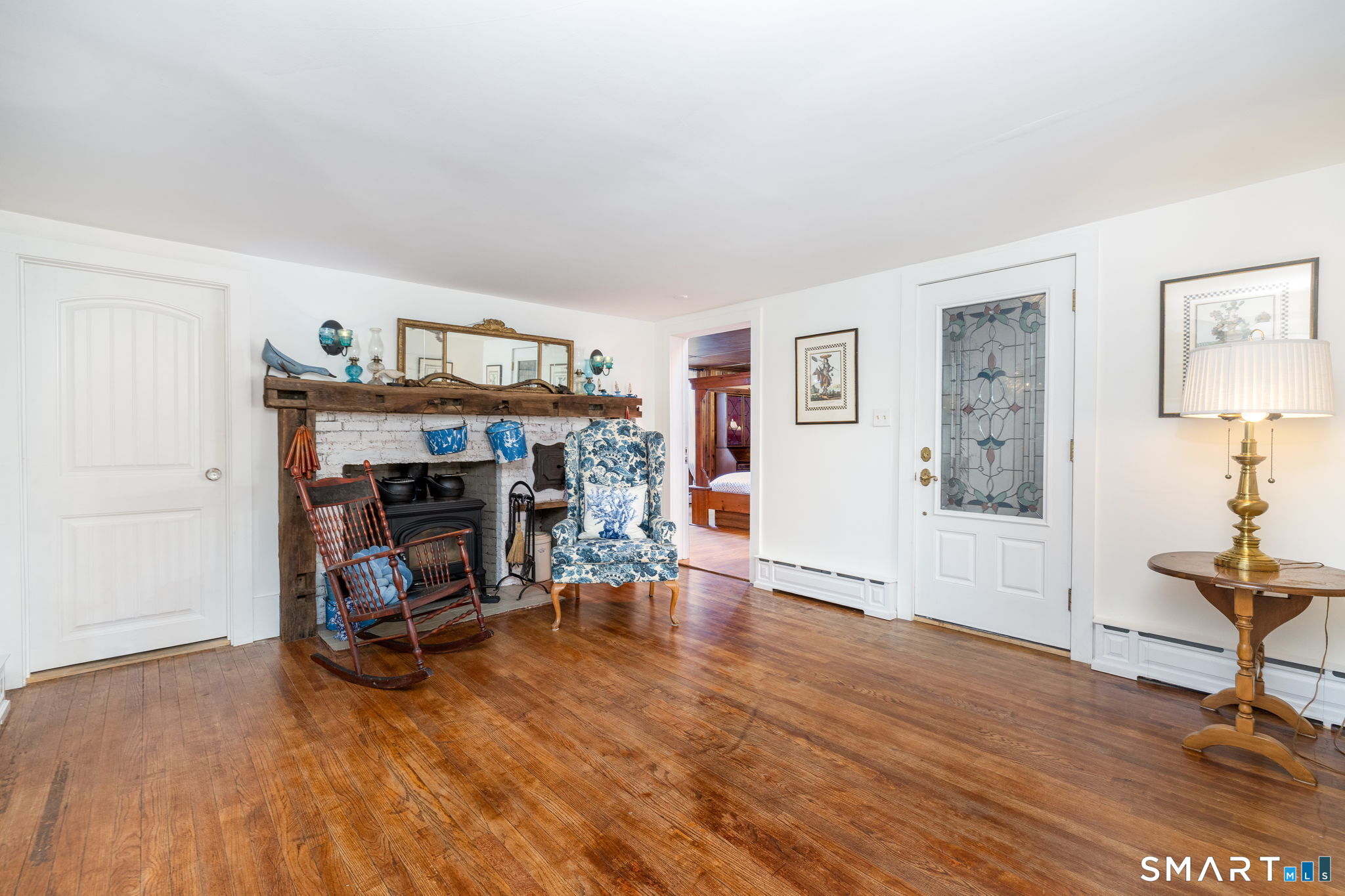 695 Spindle Hill Road Wolcott, CT 06716 - Photo 16 of 40 Hearthside Keeping Room: The estate's original 1773 foyer entry (currently a side entrance) featuring a fully equipped laundry station and full bathroom.