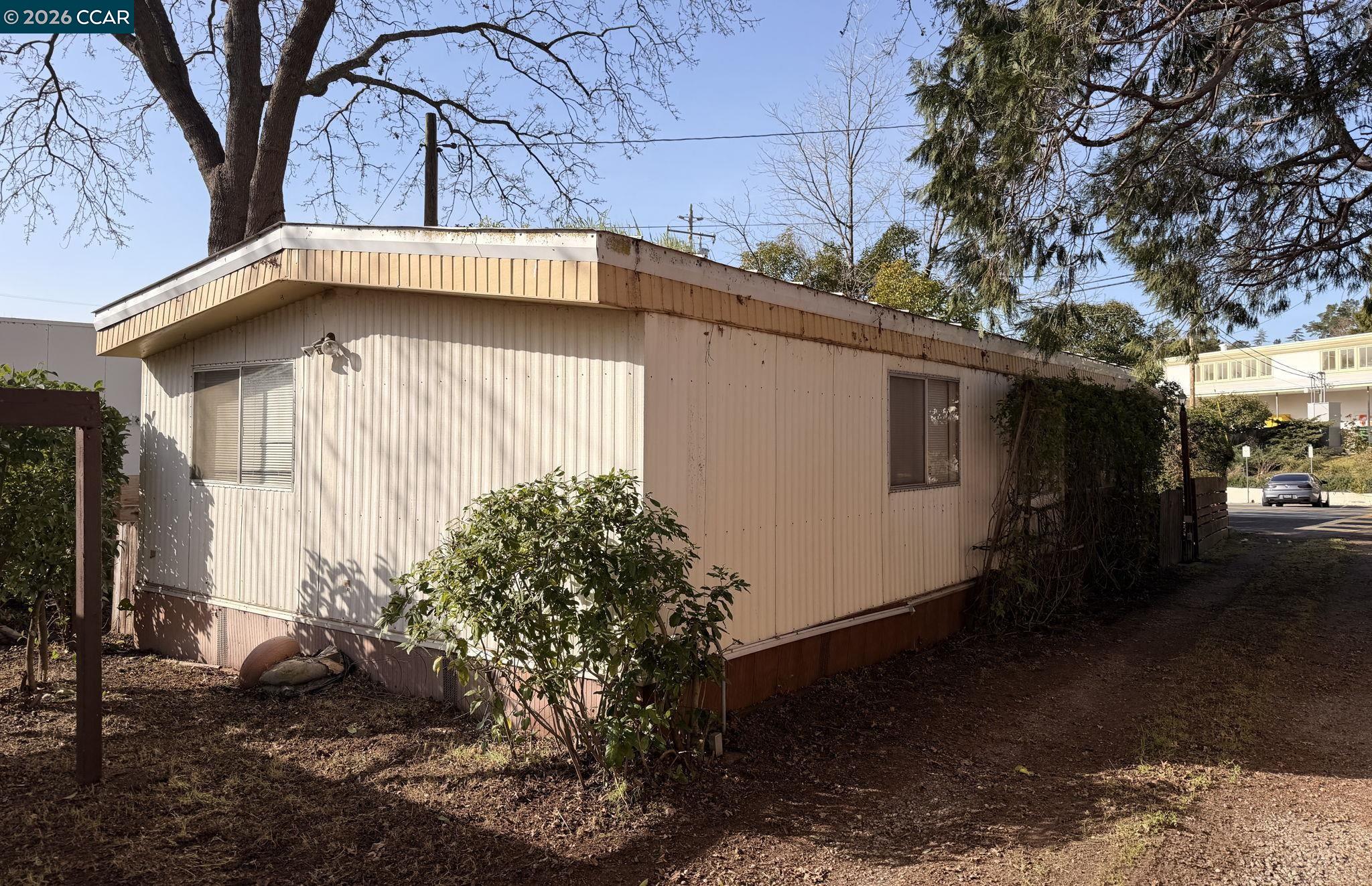 1521 Sunset Loop Lafayette, CA 94549 - Photo 18 of 19 a side view of a house with a yard