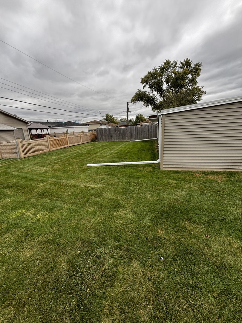 7722 West 81st Place Bridgeview, IL 60455 - Photo 11 of 13 a view of a field of grass and trees
