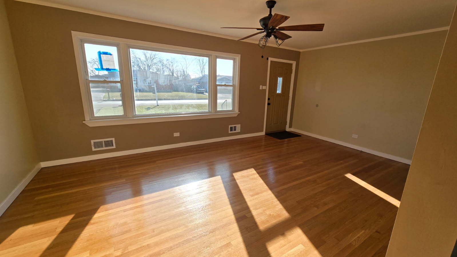 7722 West 81st Place Bridgeview, IL 60455 - Photo 2 of 13 a view of an empty room with a window