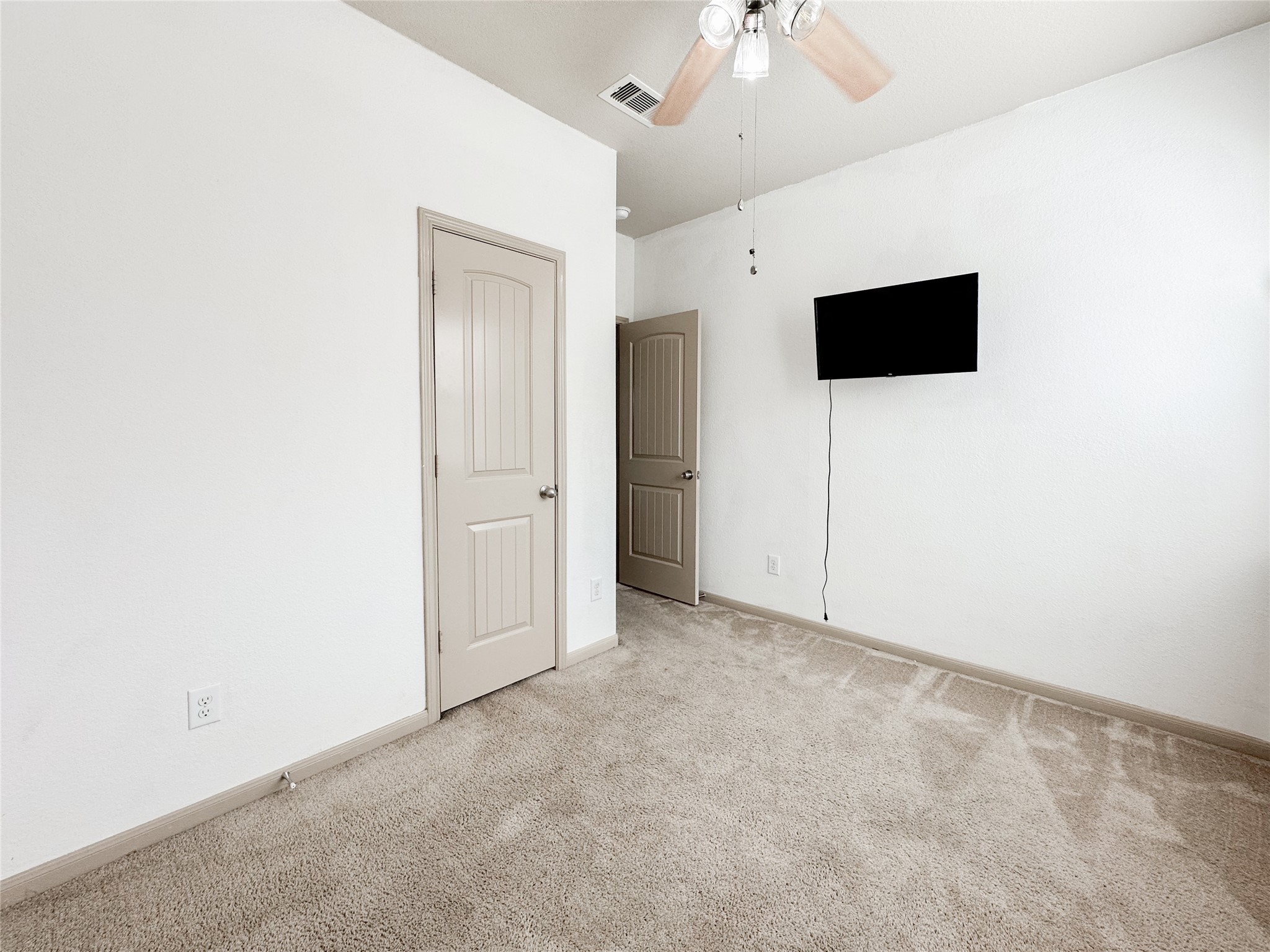 20319 Little Wing Drive Spring, TX 77388 - Photo 16 of 49 a view of an empty room with a ceiling fan