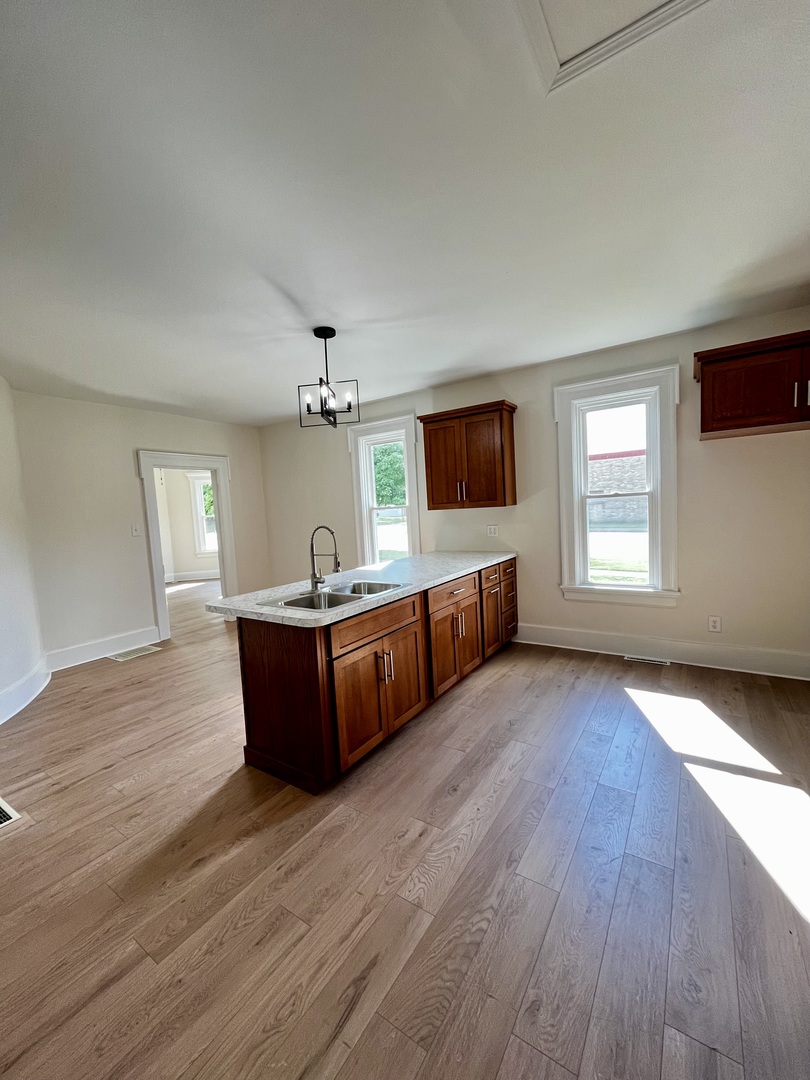 403 Uncas Street Tonica, IL 61370 - Photo 13 of 30 a living room with furniture and a wooden floor