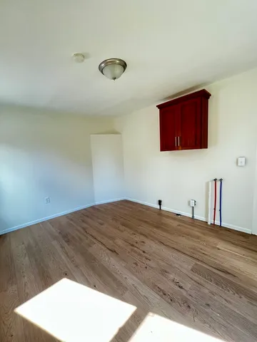 a bedroom with a bed and a cabinet