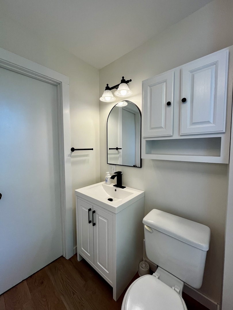403 Uncas Street Tonica, IL 61370 - Photo 17 of 30 a bathroom with a toilet sink and mirror
