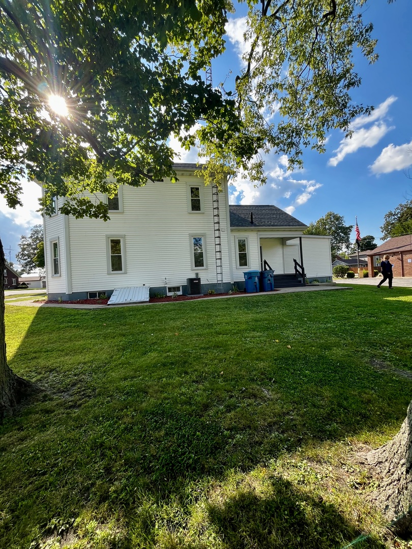 403 Uncas Street Tonica, IL 61370 - Photo 5 of 30 a view of a house with a backyard porch and sitting area