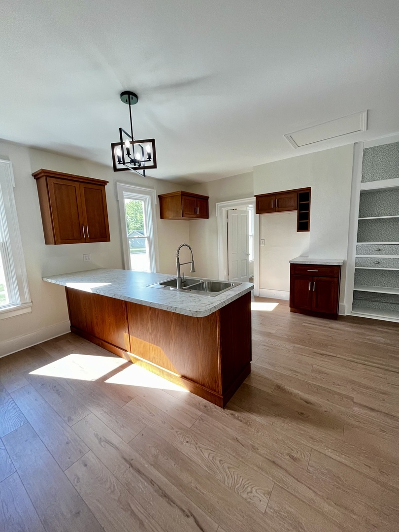 403 Uncas Street Tonica, IL 61370 - Photo 10 of 30 a living room with furniture and a wooden floor