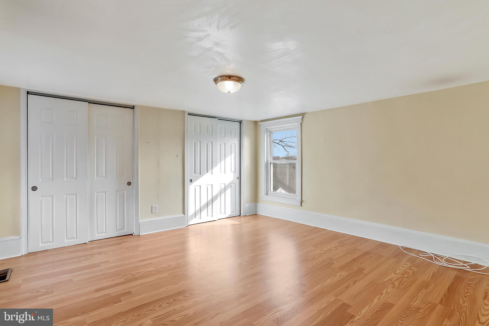 13837 Big Pool Road Clear Spring, MD 21722 - Photo 19 of 57 a view of an empty room with wooden floor and a window