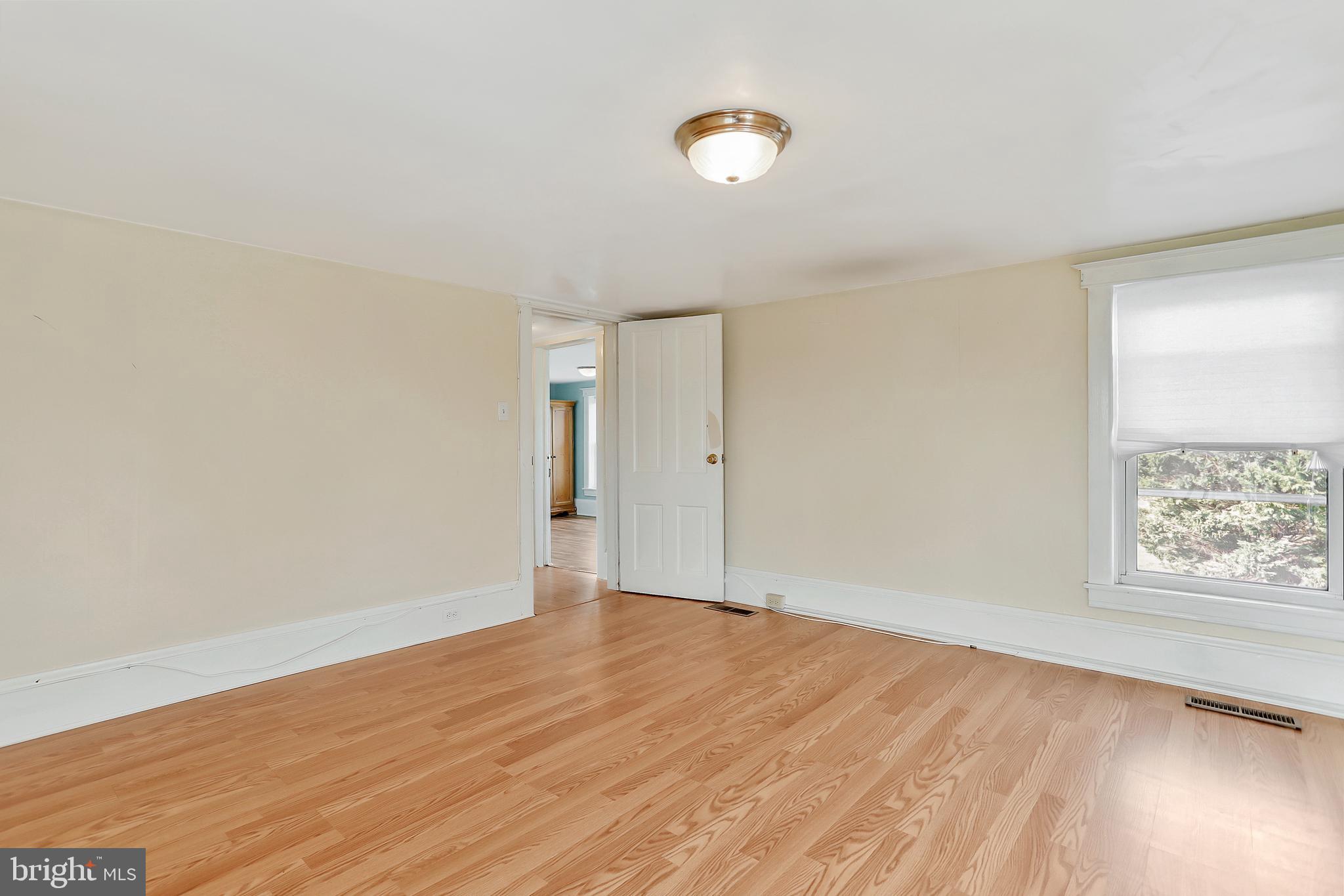13837 Big Pool Road Clear Spring, MD 21722 - Photo 20 of 57 an empty room with wooden floor and windows