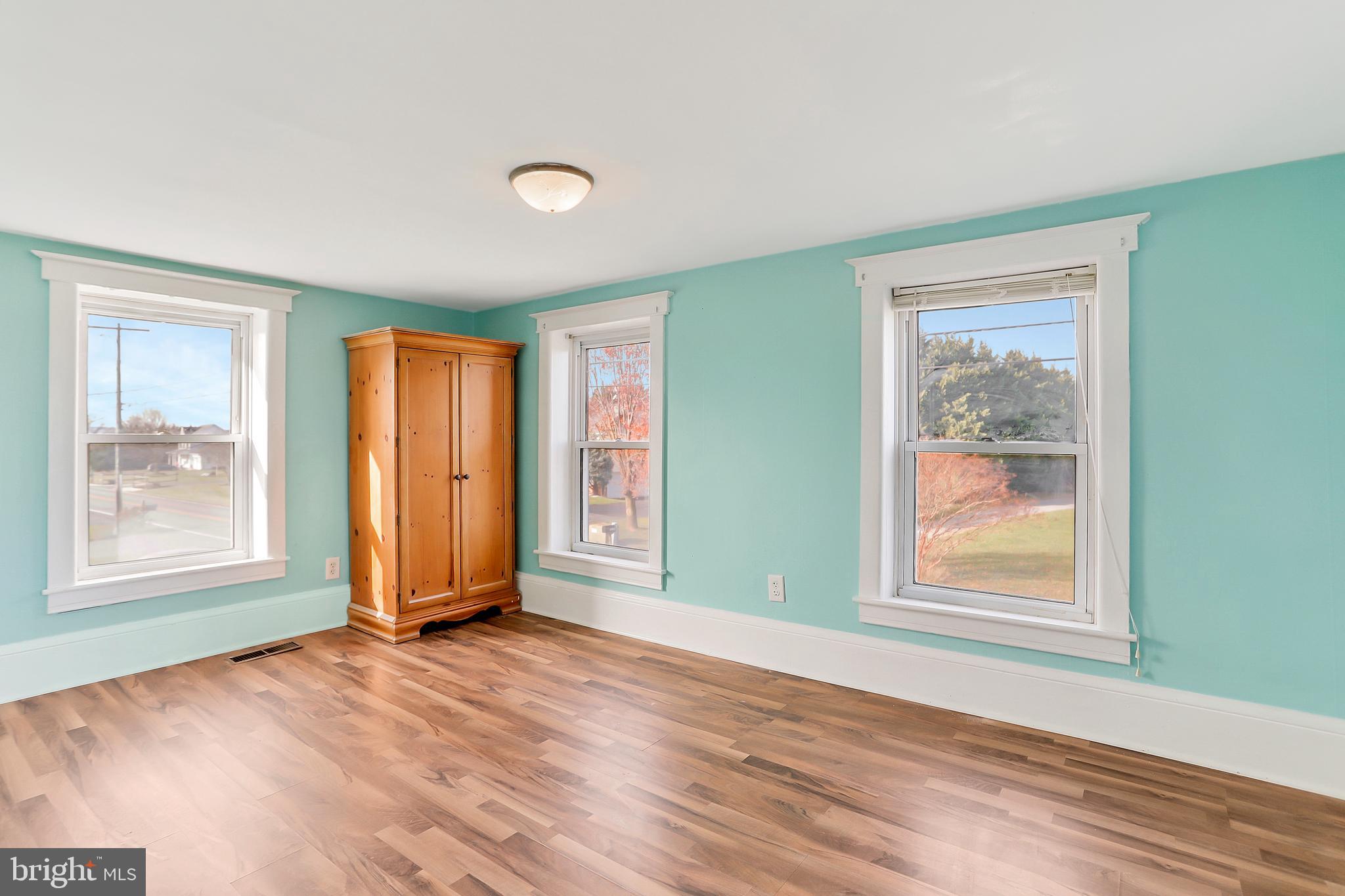 13837 Big Pool Road Clear Spring, MD 21722 - Photo 21 of 57 a view of an empty room with window and wooden floor