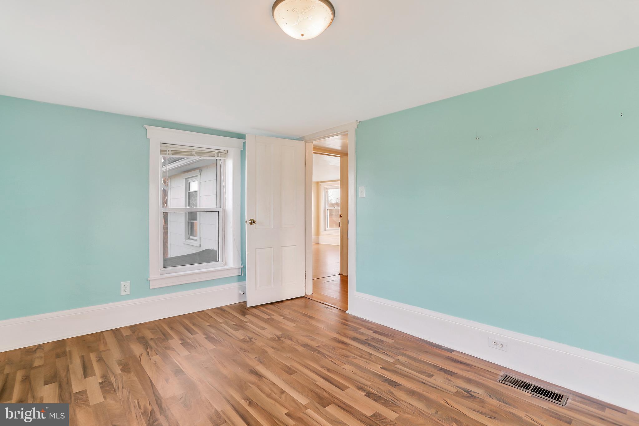 13837 Big Pool Road Clear Spring, MD 21722 - Photo 22 of 57 a view of empty room with wooden floor and fan