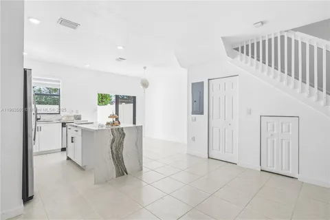 a view of kitchen with furniture and window