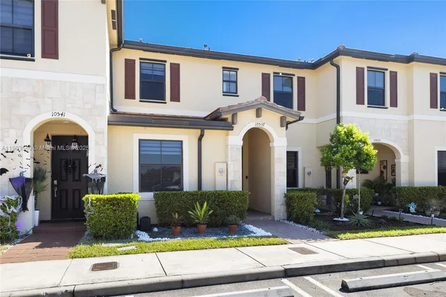 a front view of a house with yard