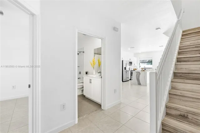 a view of a hallway view with staircase