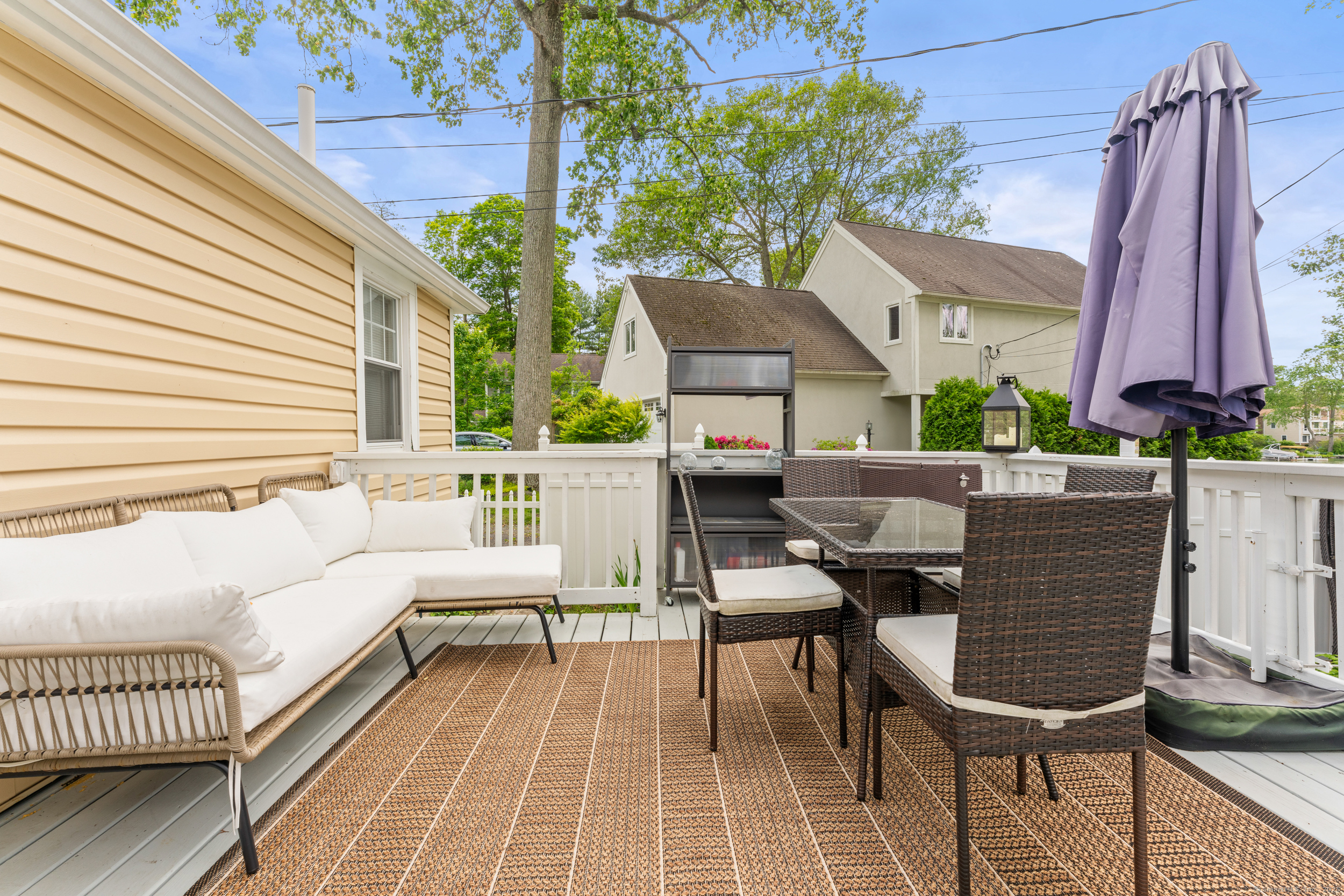 15 Hawthorne Road East Hampton, CT 06424 - Photo 18 of 19 a view of a patio with a table and chairs