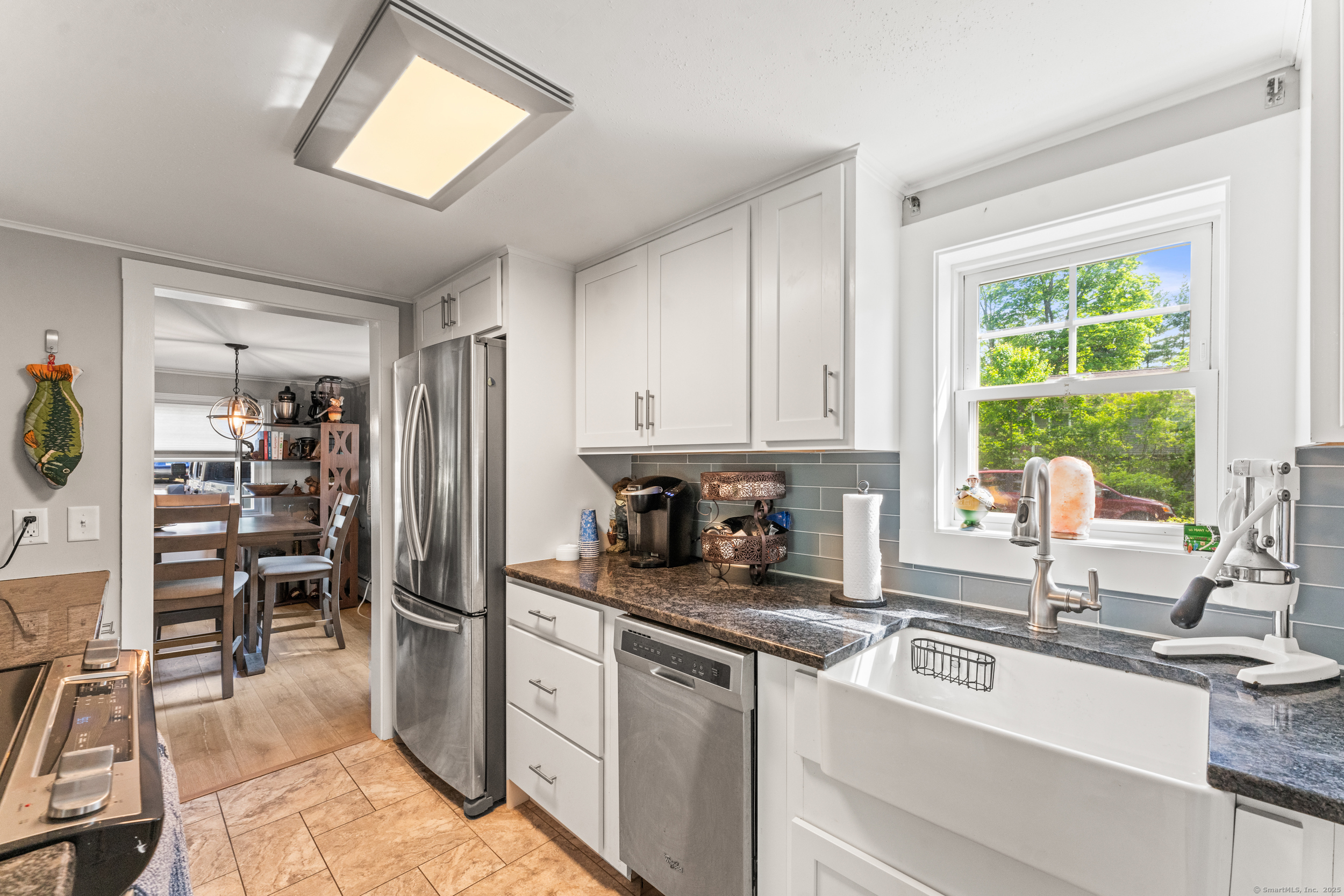 15 Hawthorne Road East Hampton, CT 06424 - Photo 2 of 19 a kitchen with granite countertop a refrigerator and a sink