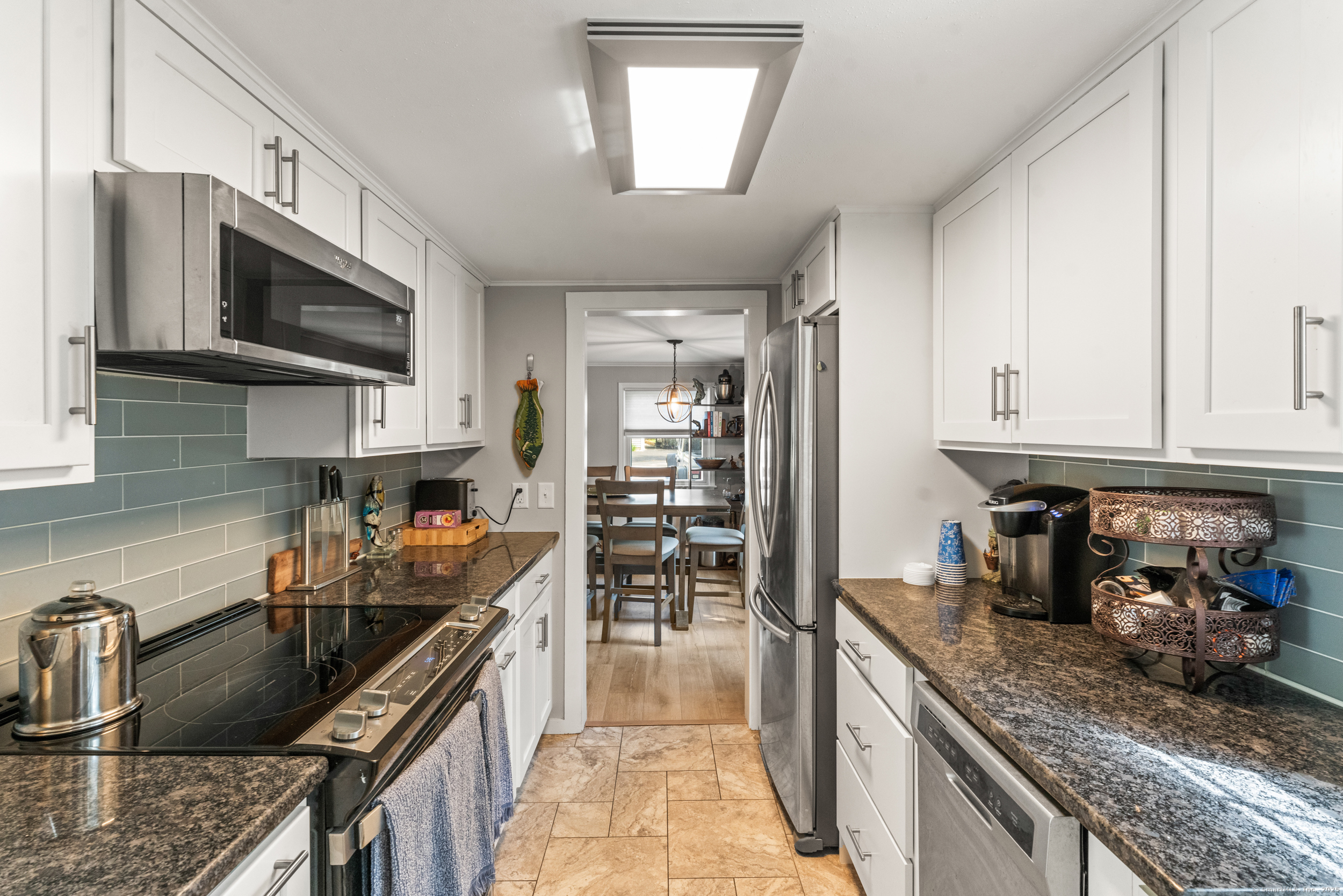 15 Hawthorne Road East Hampton, CT 06424 - Photo 3 of 19 a kitchen with stainless steel appliances granite countertop a sink stove and refrigerator