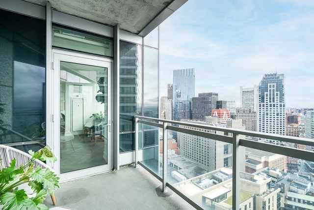 a view of a balcony with a potted plant