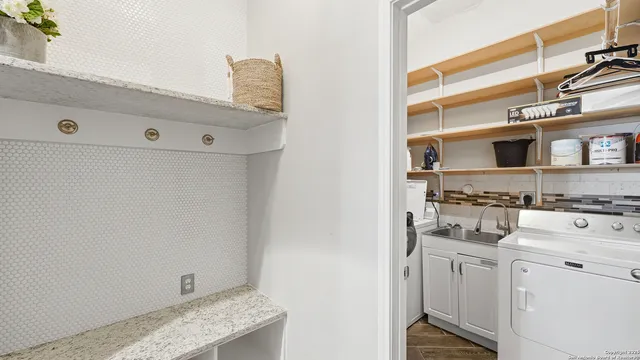 a utility room with dryer and washer