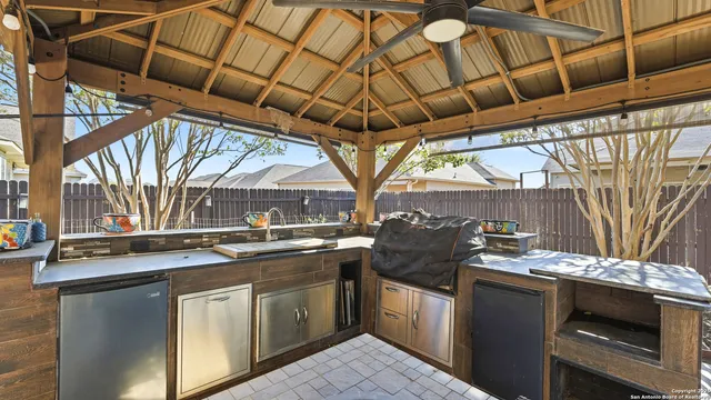 a view of a chairs and table in a patio