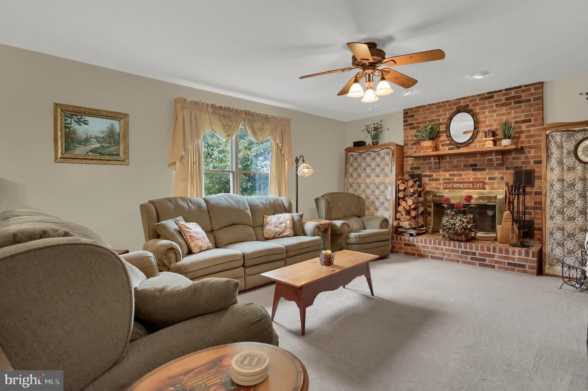 114 Abbey Road New Freedom, PA 17349 - Photo 22 of 46 Cozy Main Floor Family Room with Brick Fireplace