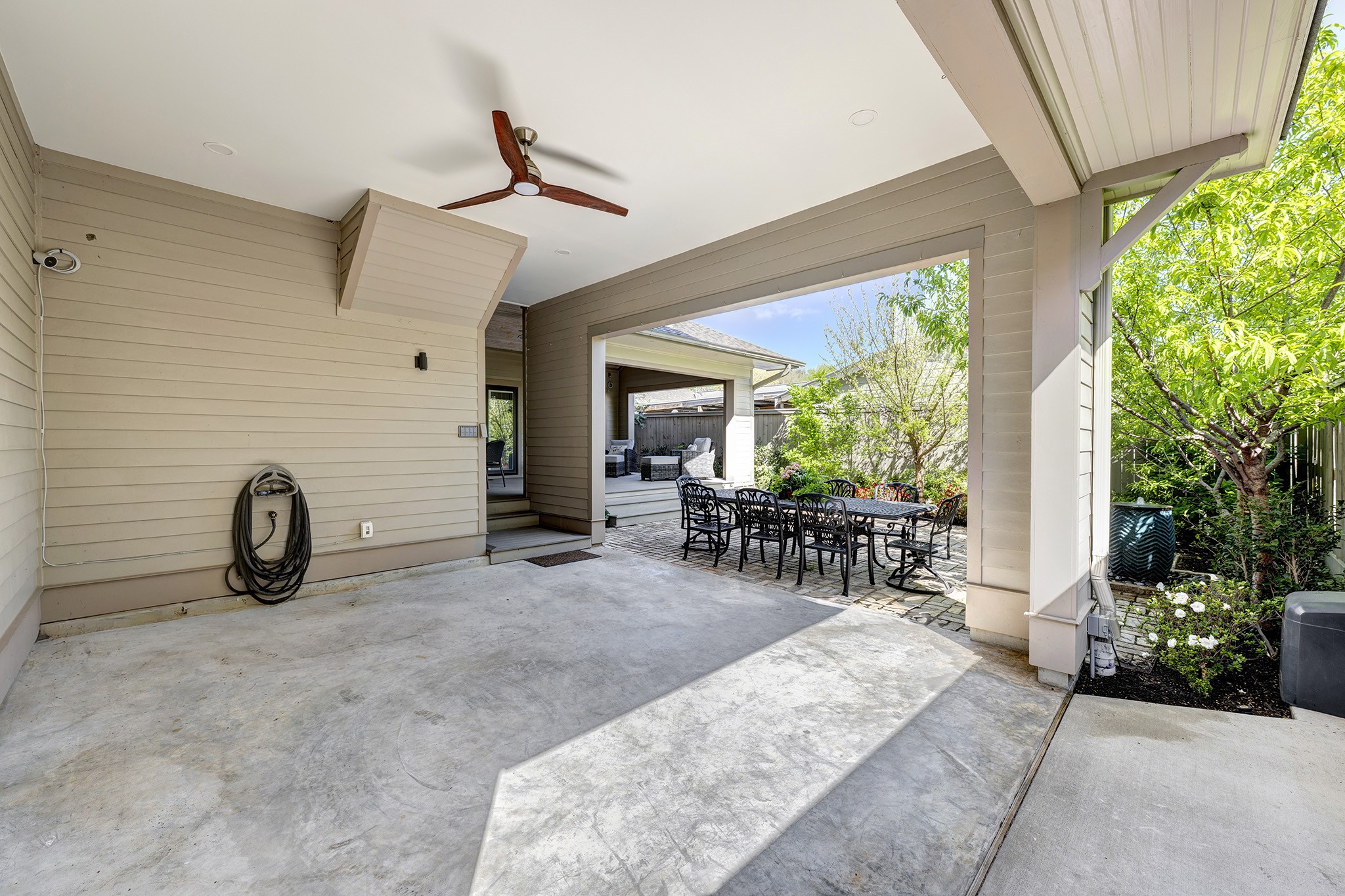 1314 Harvard Street Houston, TX 77008 - Photo 31 of 36 a view of a patio with table and chairs potted plants with wooden floor