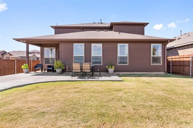 a view of swimming pool with outdoor seating