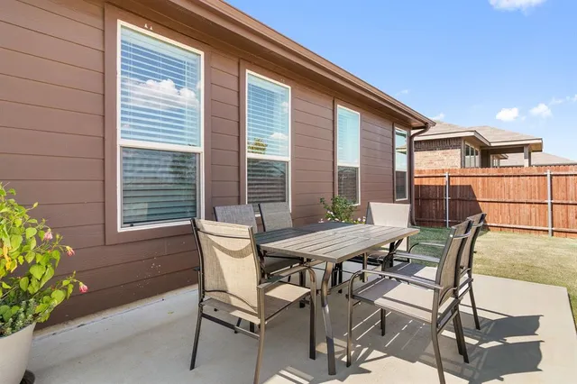 a view of a house with patio and wooden floor