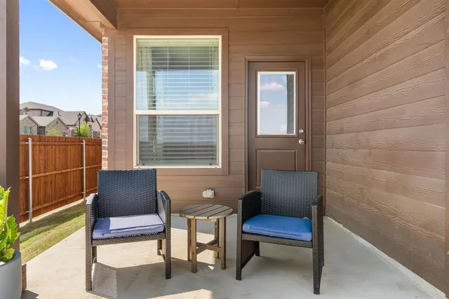 a outdoor living space with furniture and a window