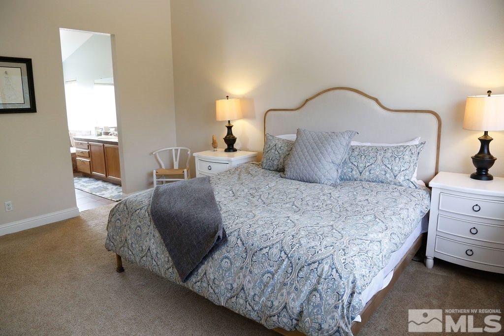9841 Eastmont Court Reno, NV 89521 - Photo 20 of 38 a bedroom with a bed and lamp