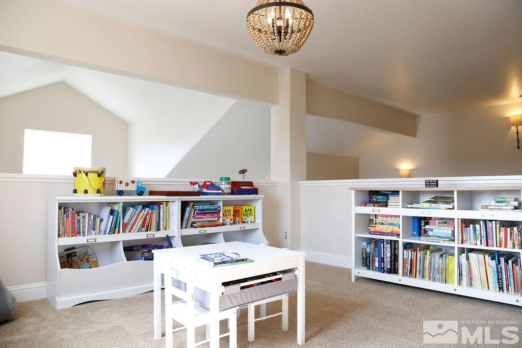 9841 Eastmont Court Reno, NV 89521 - Photo 25 of 38 a room with furniture and a book shelf