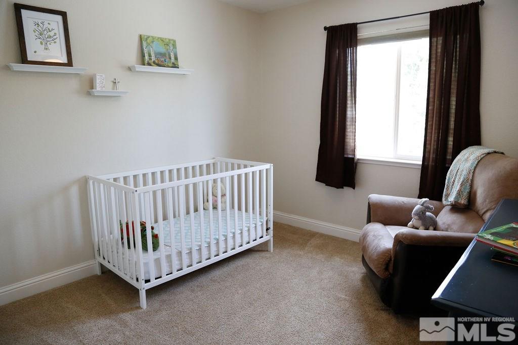 9841 Eastmont Court Reno, NV 89521 - Photo 28 of 38 a room with furniture and a window
