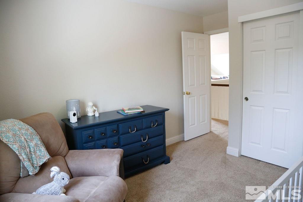 9841 Eastmont Court Reno, NV 89521 - Photo 29 of 38 a room with a couch and a dresser