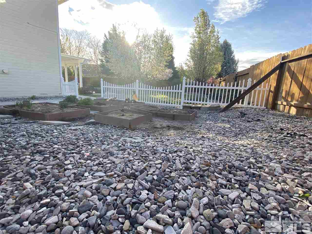 9841 Eastmont Court Reno, NV 89521 - Photo 35 of 38 a view of a yard with a house in the background