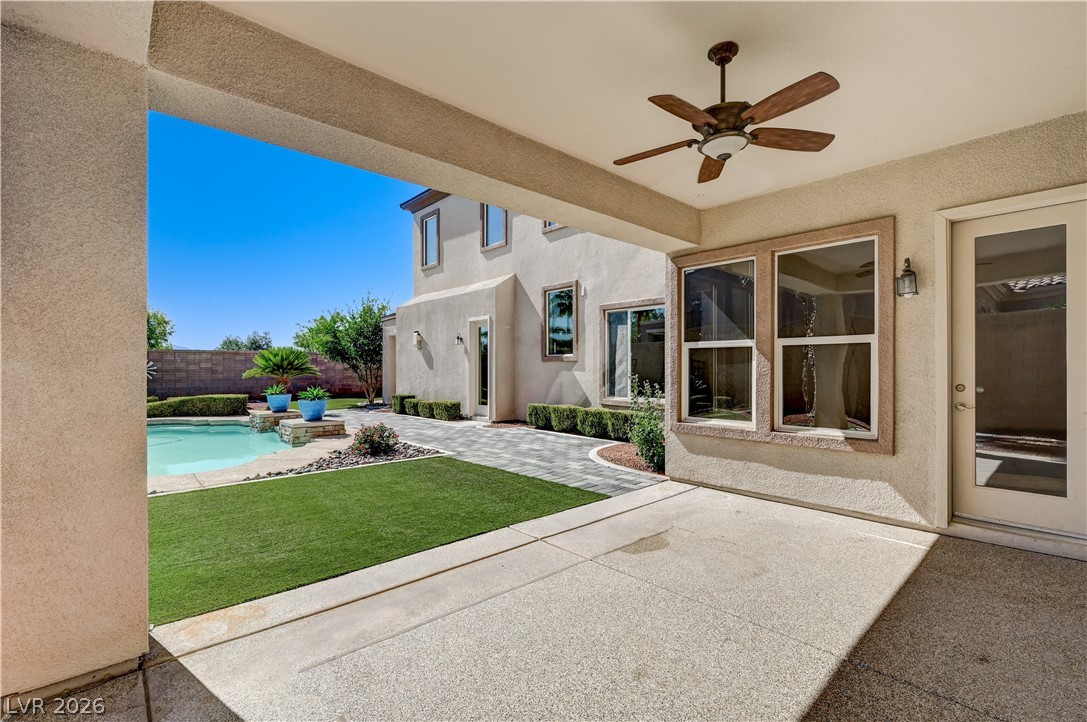 2793 Rosenhearty Drive Henderson, NV 89044 - Photo 61 of 85 Relax and unwind in this inviting outdoor retreat, featuring a sparkling pool and a covered patio for ultimate comfort.