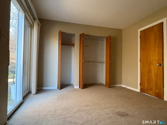 a view of empty room with closet