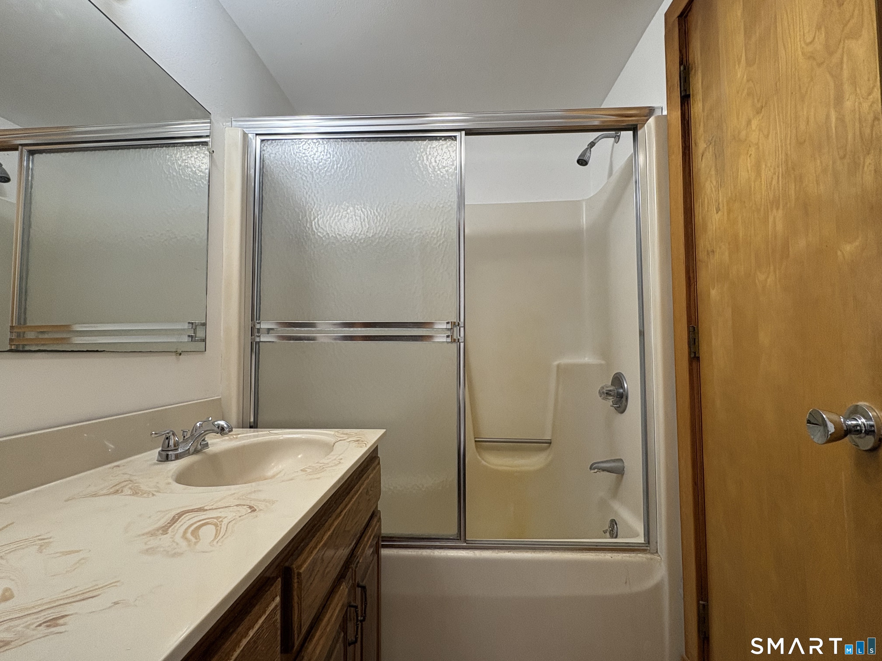 278 Chamberlain Road, Unit IN Middletown, CT 06457 - Photo 6 of 7 a bathroom with a granite countertop sink mirror and shower