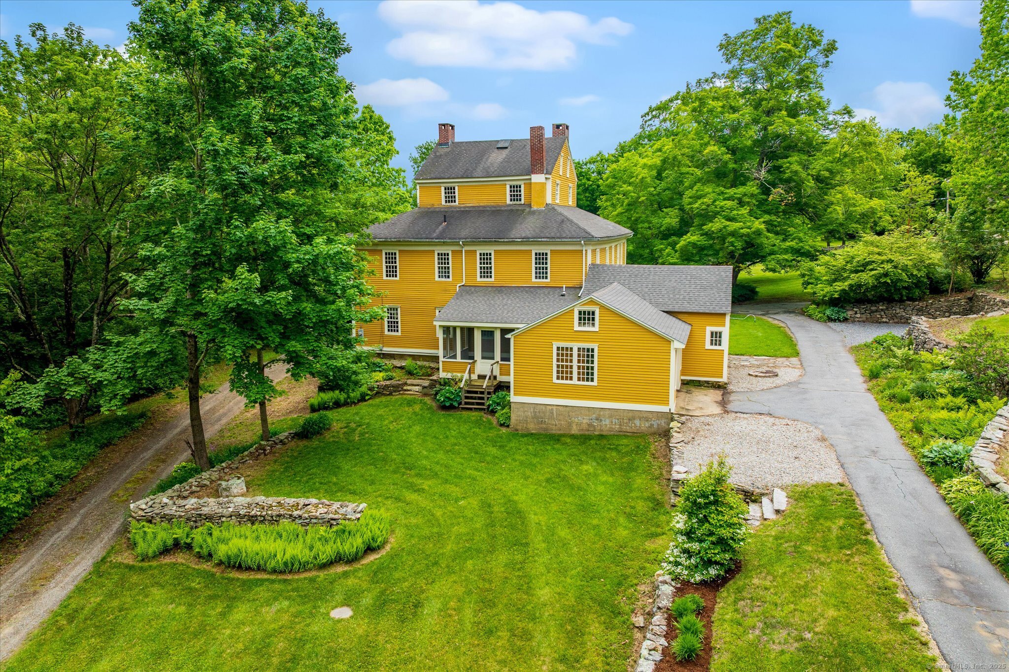 89 John Perry Road Eastford, CT 06242 - Photo 12 of 40 an aerial view of a house with a big yard and large trees