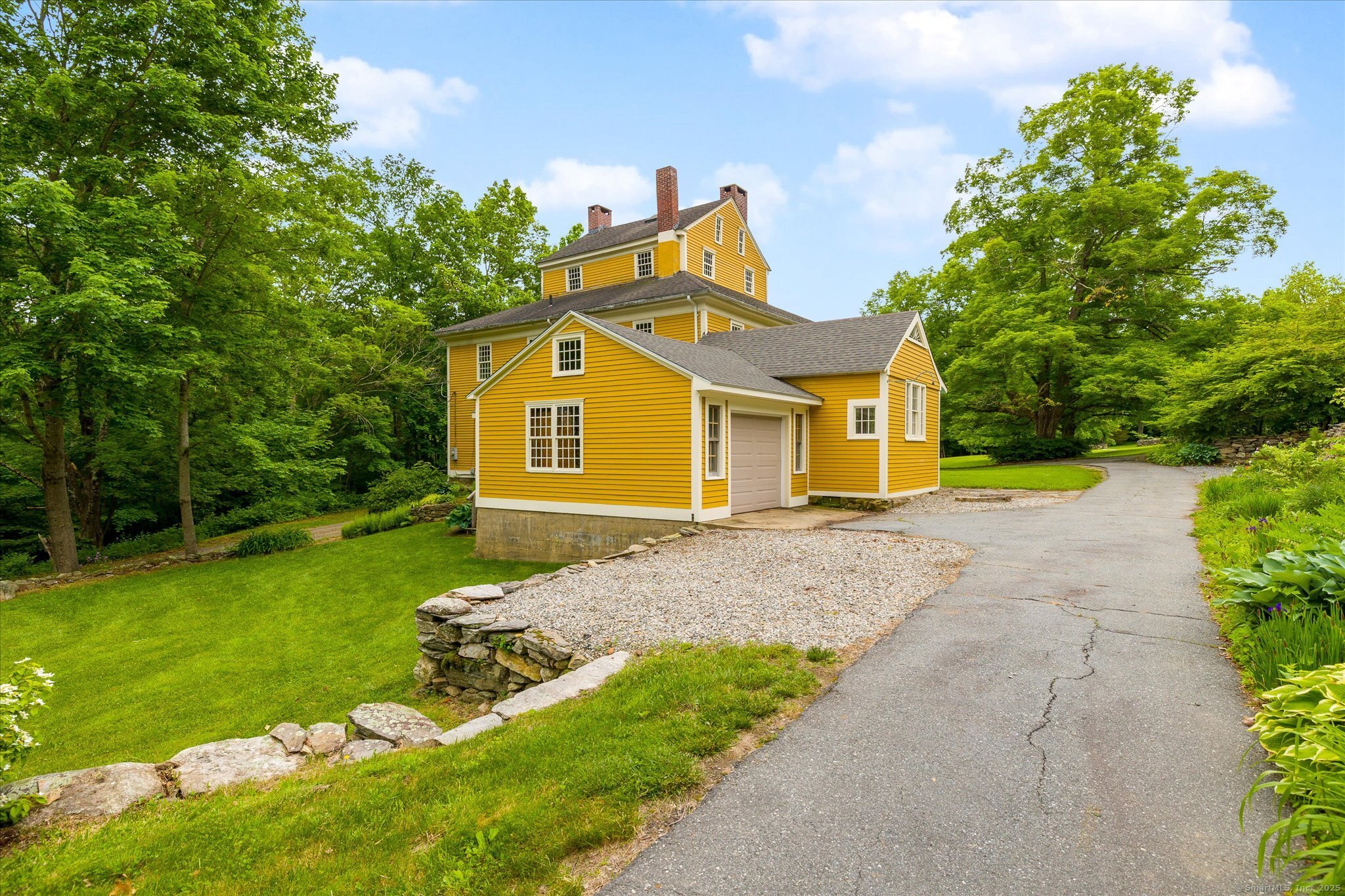 89 John Perry Road Eastford, CT 06242 - Photo 17 of 40 a front view of a house with garden