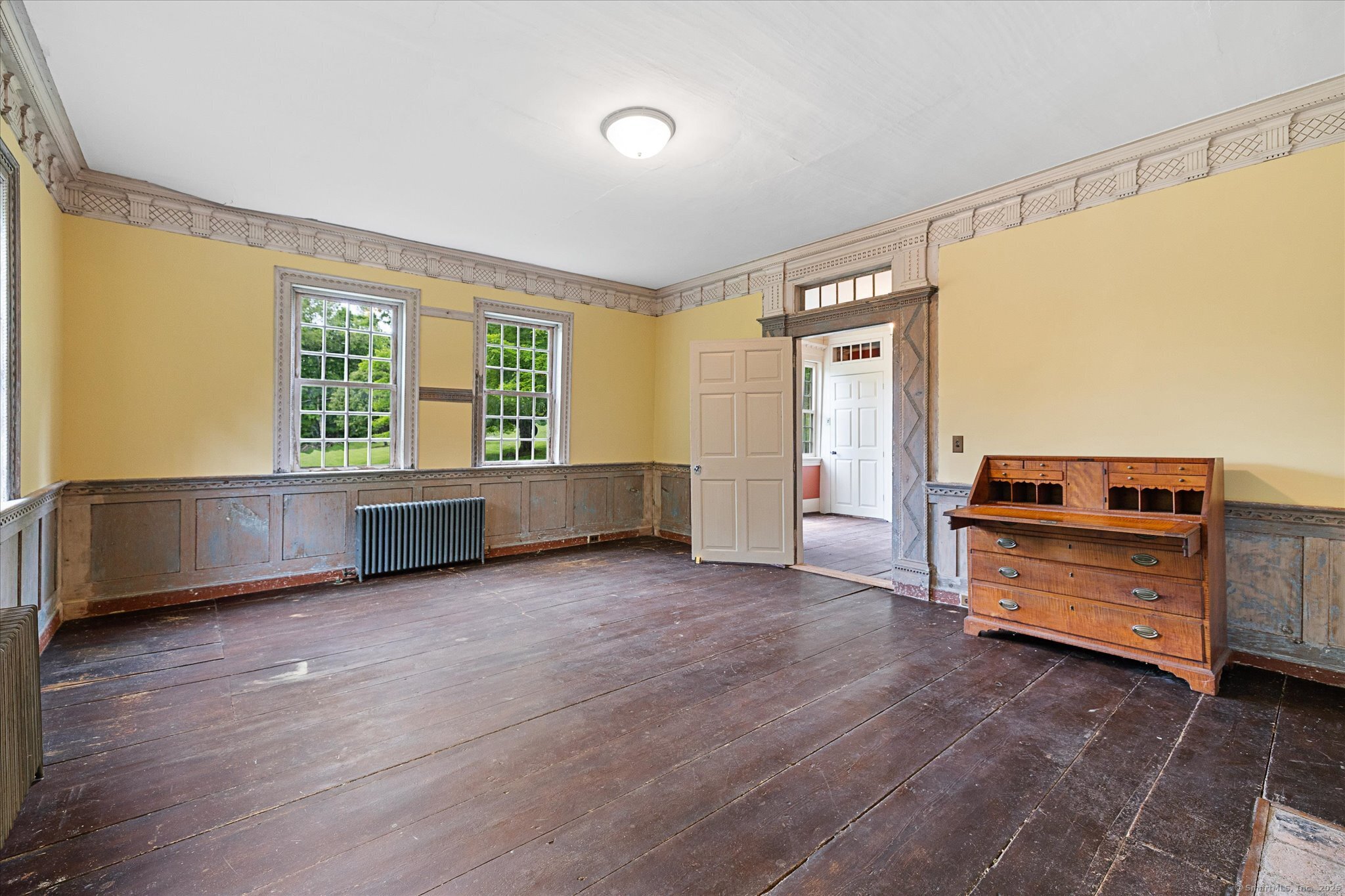 89 John Perry Road Eastford, CT 06242 - Photo 21 of 40 a view of an empty room with a window and wooden floor