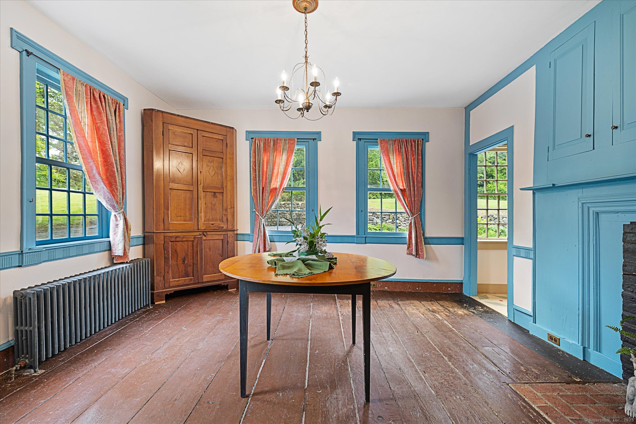 89 John Perry Road Eastford, CT 06242 - Photo 26 of 40 a view of a dining room with furniture wooden floor and chandelier