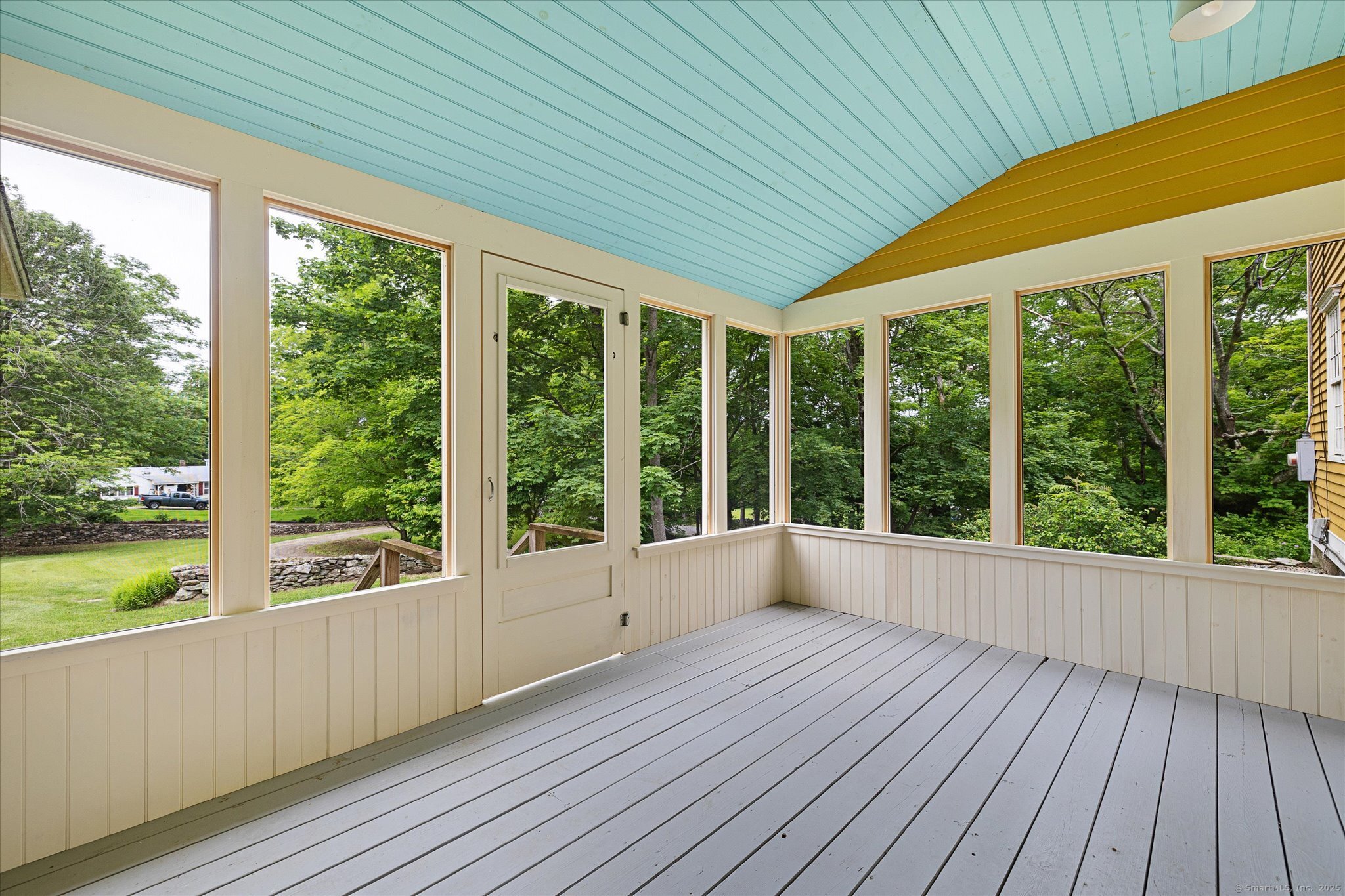 89 John Perry Road Eastford, CT 06242 - Photo 30 of 40 a view of an empty room with wooden floor and walls