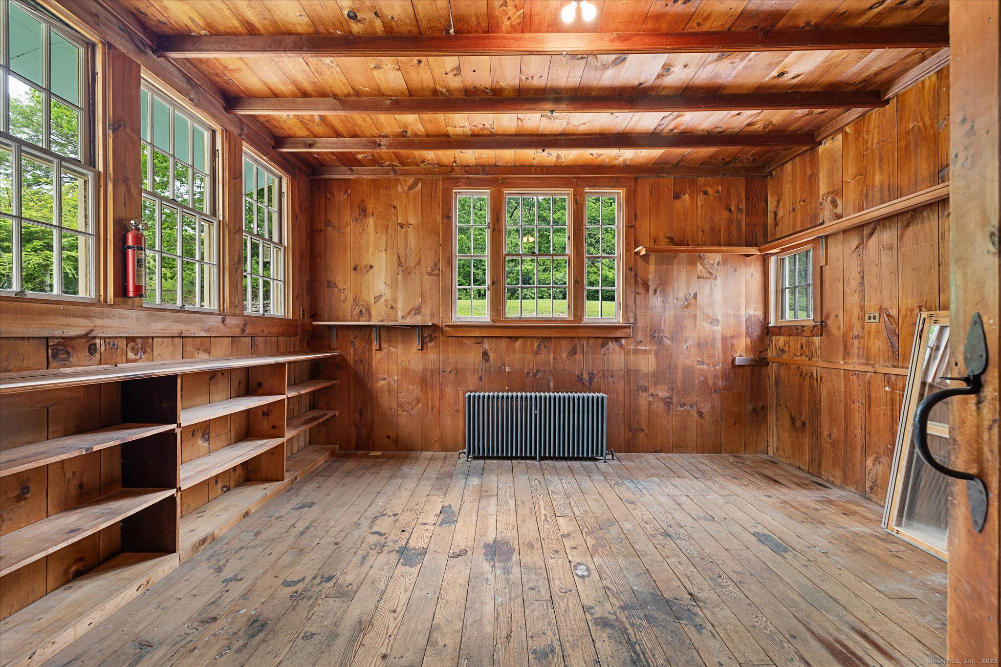 89 John Perry Road Eastford, CT 06242 - Photo 31 of 40 a room with window and wooden floor