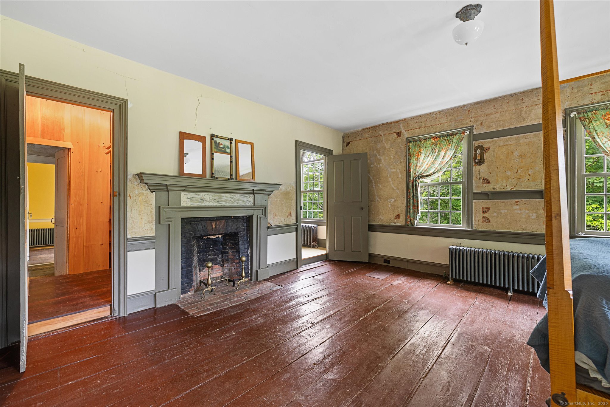 89 John Perry Road Eastford, CT 06242 - Photo 33 of 40 a view of an empty room with wooden floor fireplace and a window