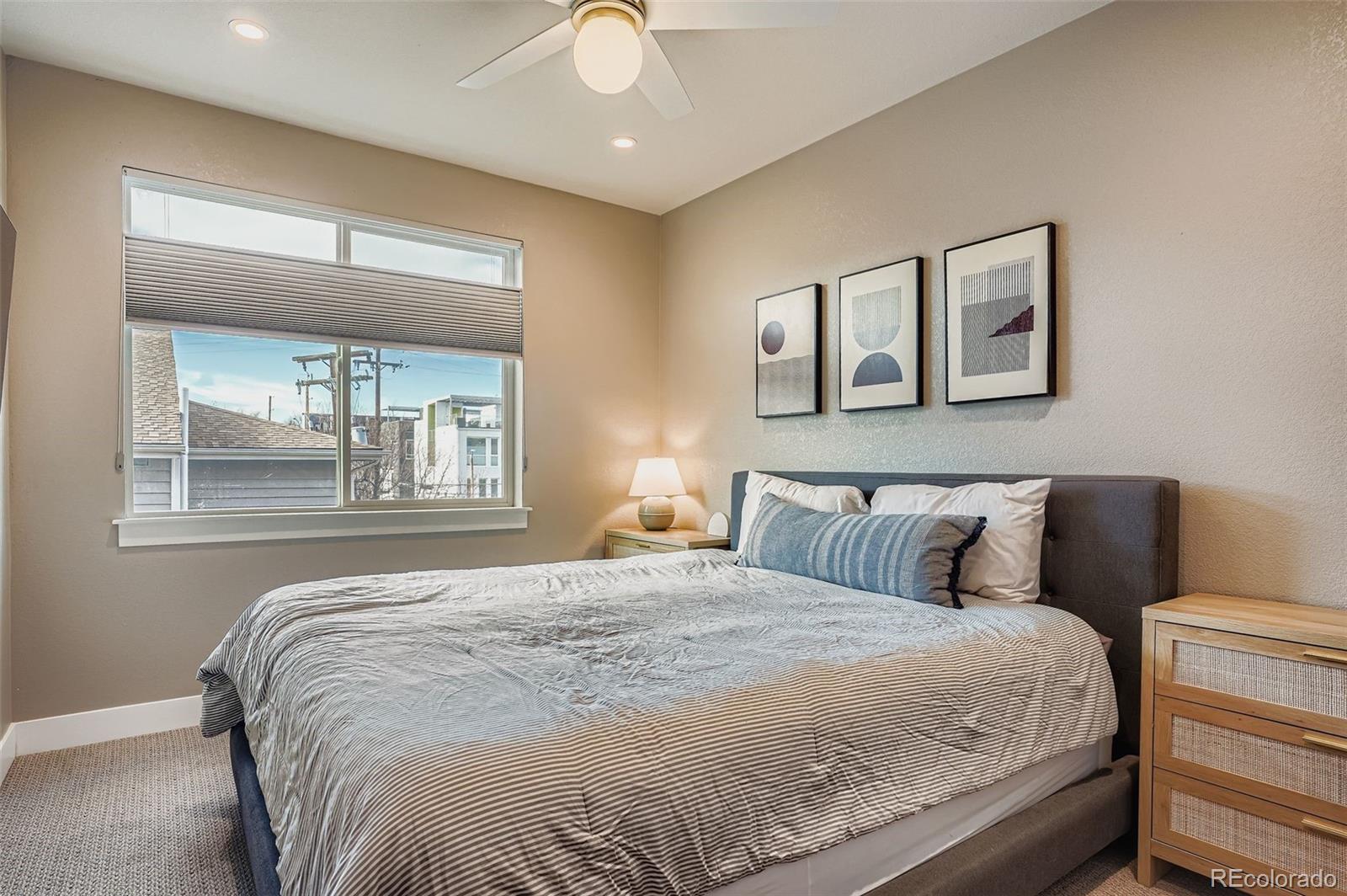 2739 West 24th Avenue, Unit 7 Denver, CO 80211 - Photo 17 of 31 a bedroom with a large bed and a window