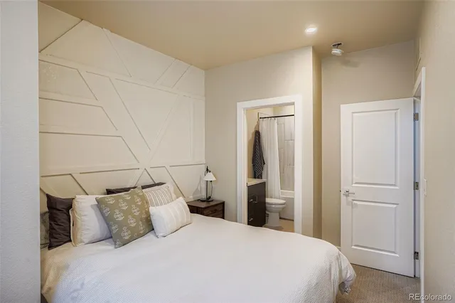 a large bed in a white room