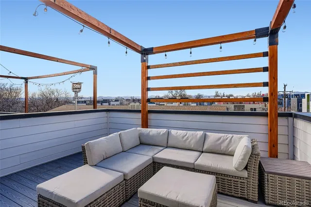 a view of a balcony with furniture