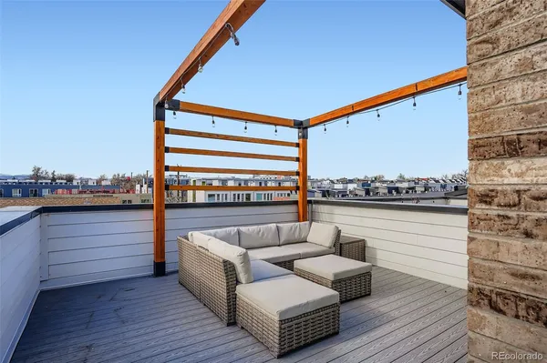 a balcony with furniture and city view