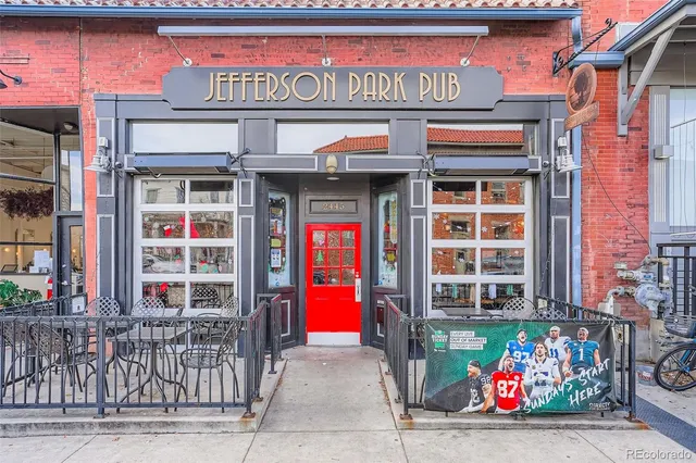 a view of a cafe with a couple of people seating