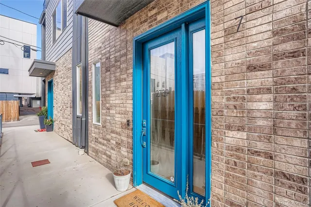 a view of a brick house with an outdoor space