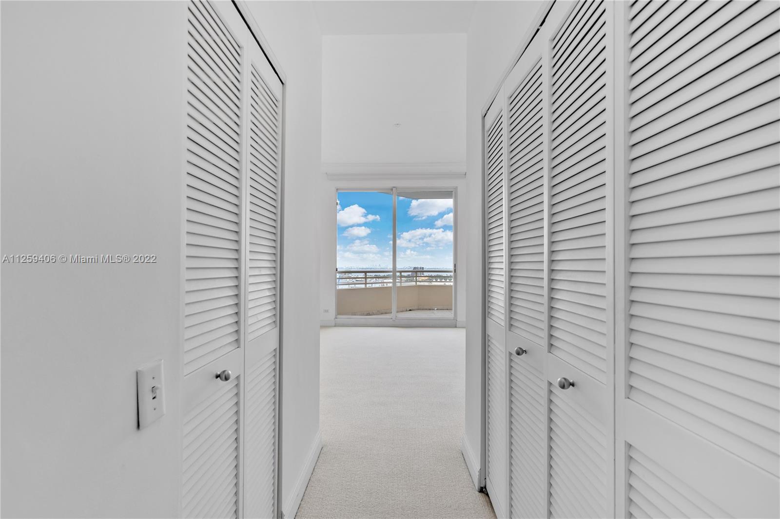 888 Brickell Key Drive, Unit 2610 Miami, FL 33131 - Photo 15 of 31 a view of a bathroom from a hallway